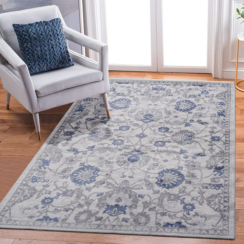 Blue oriental area rug with floral damask pattern and detailed border