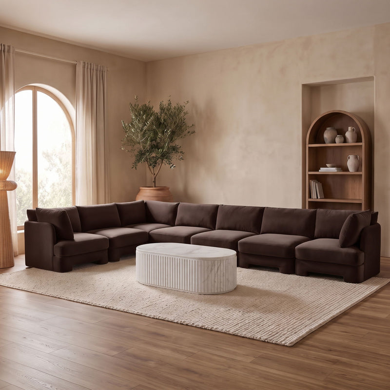 Brown velvet sectional sofa with square arms and padded back cushions