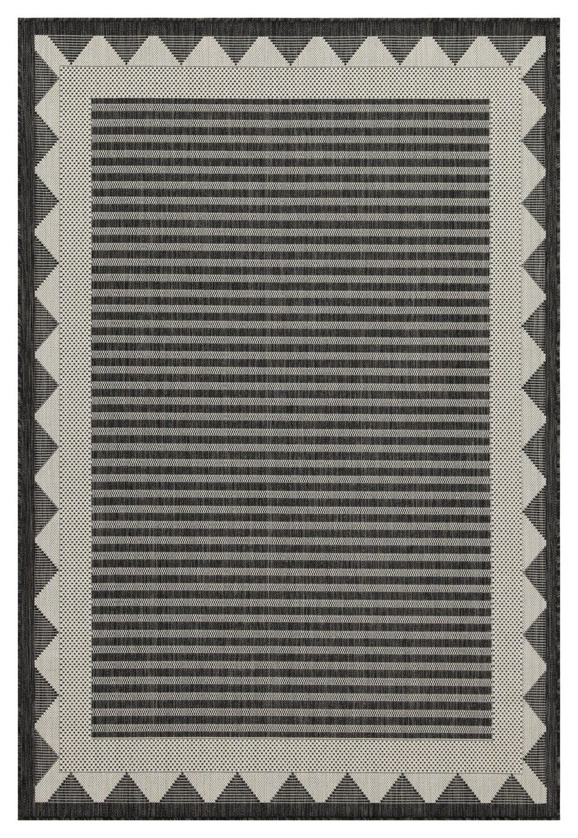Dark gray striped area rug with cream zigzag border and flat woven texture