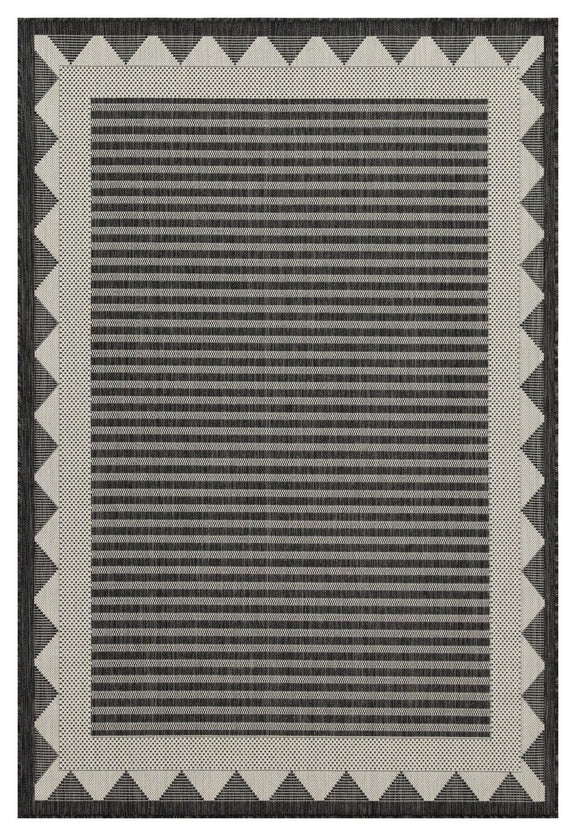 Dark gray striped area rug with cream zigzag border and flat woven texture