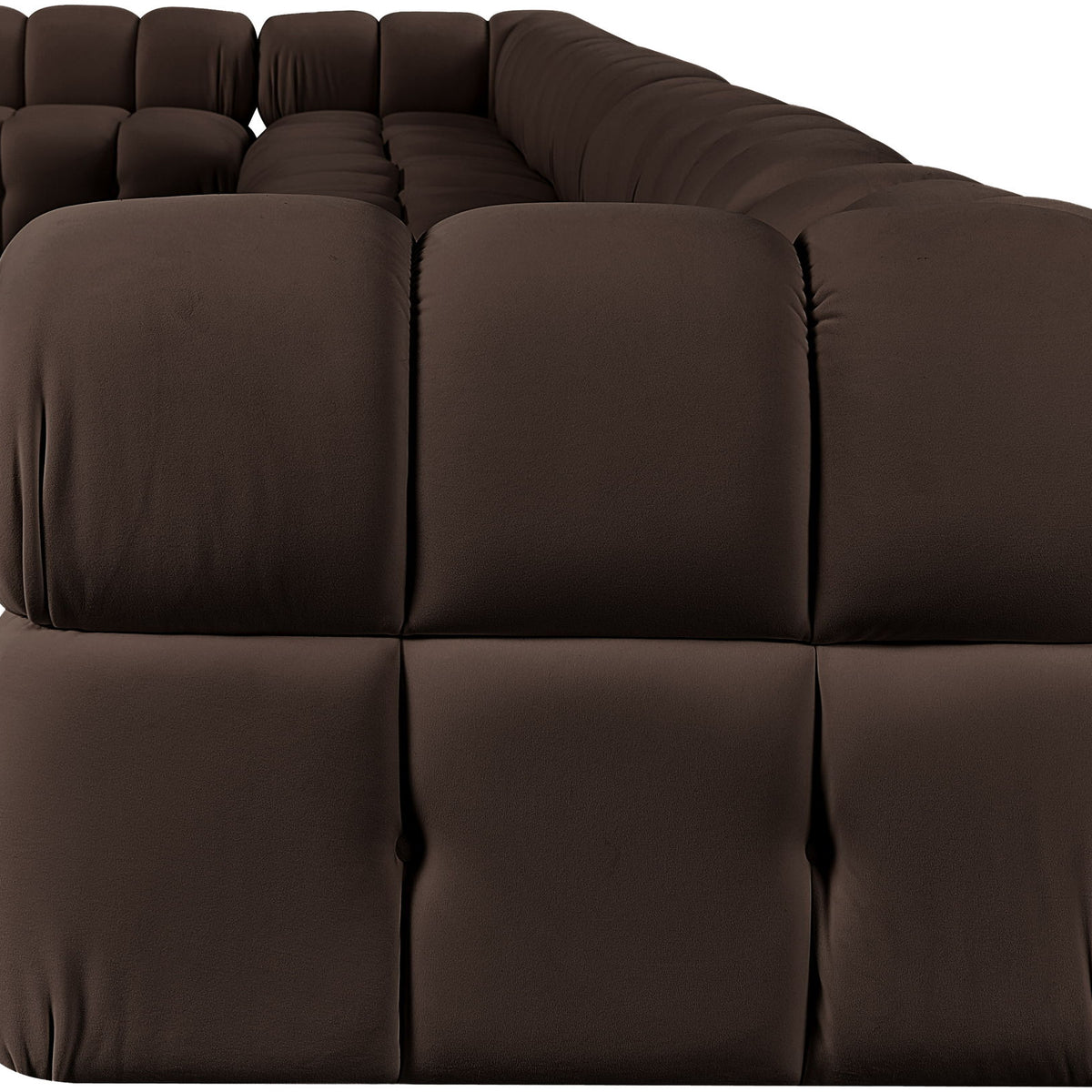 L-shaped velvet sectional sofa in dark brown with tufted seat cushions and rounded arm sections