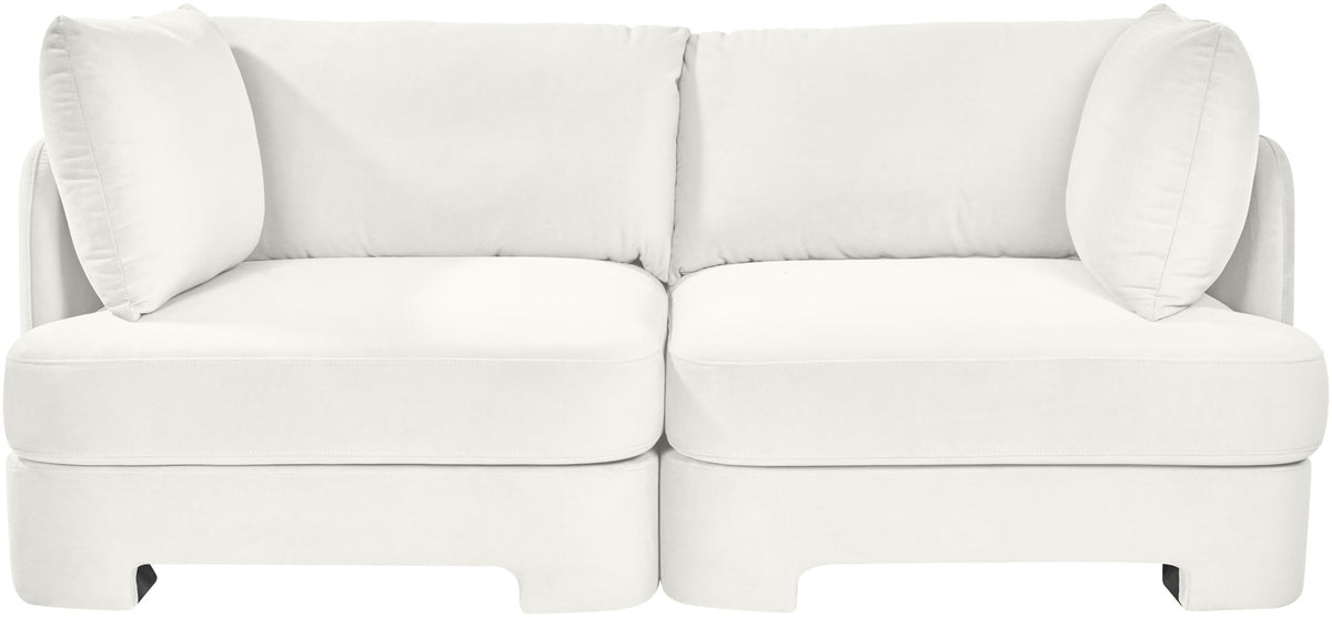 White velvet upholstered 2-piece loveseat with two seat sections and large back pillows