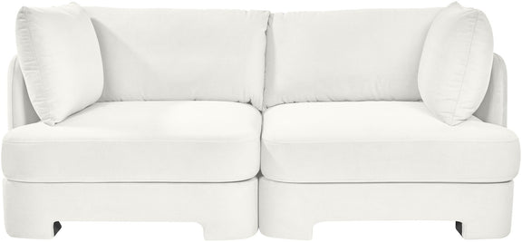 White velvet upholstered 2-piece loveseat with two seat sections and large back pillows