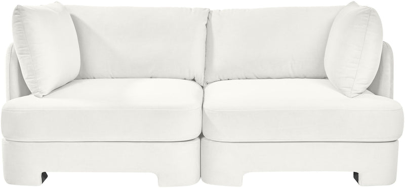 White velvet upholstered 2-piece loveseat with two seat sections and large back pillows