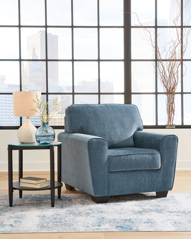 Blue upholstered armchair with rolled arms, seat cushion, and black tapered legs