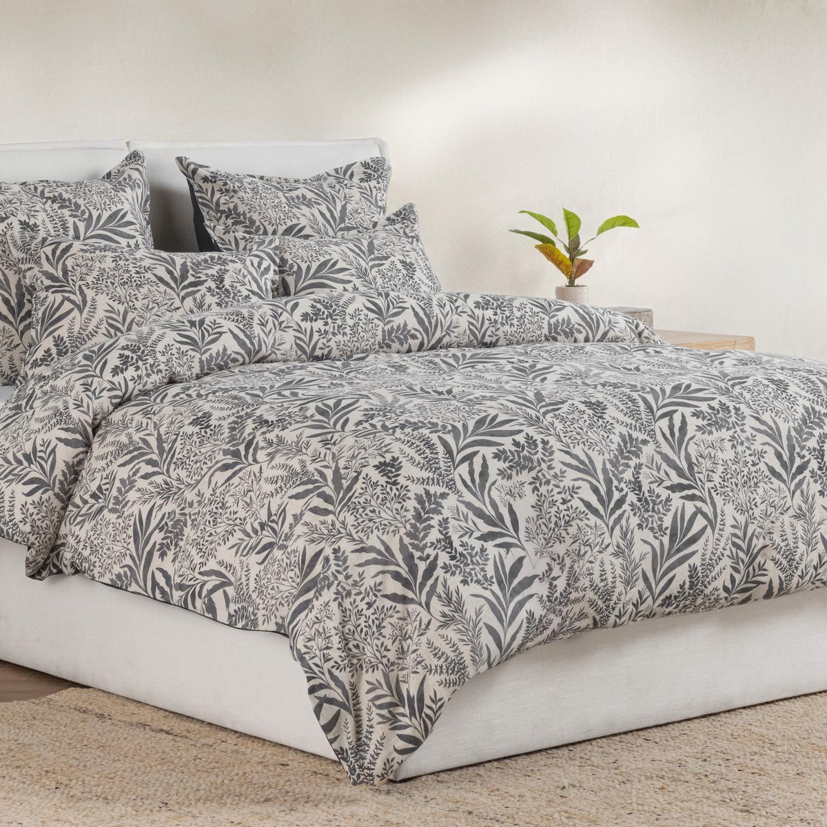 Denim blue leaf-pattern duvet set with multiple pillow shams