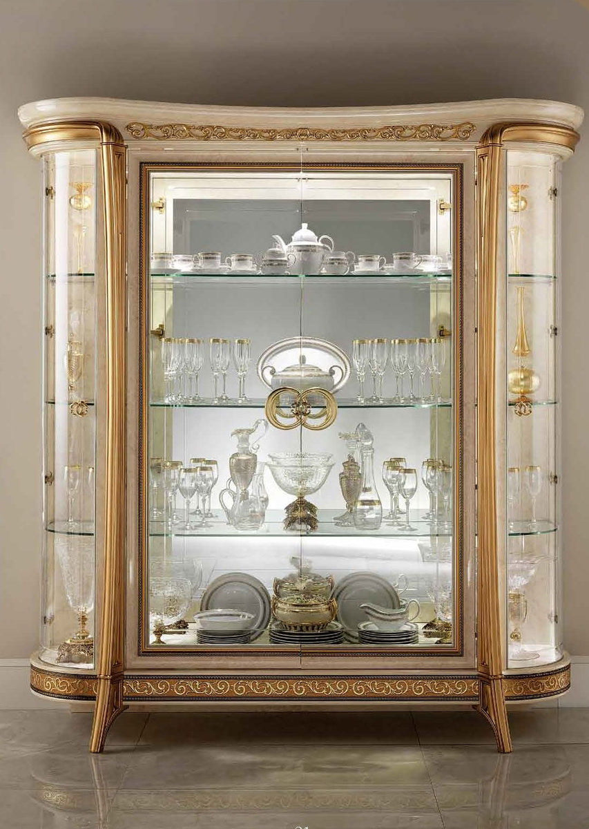 Beige and gold 4-door glass display cabinet with ornate trim and mirrored shelves