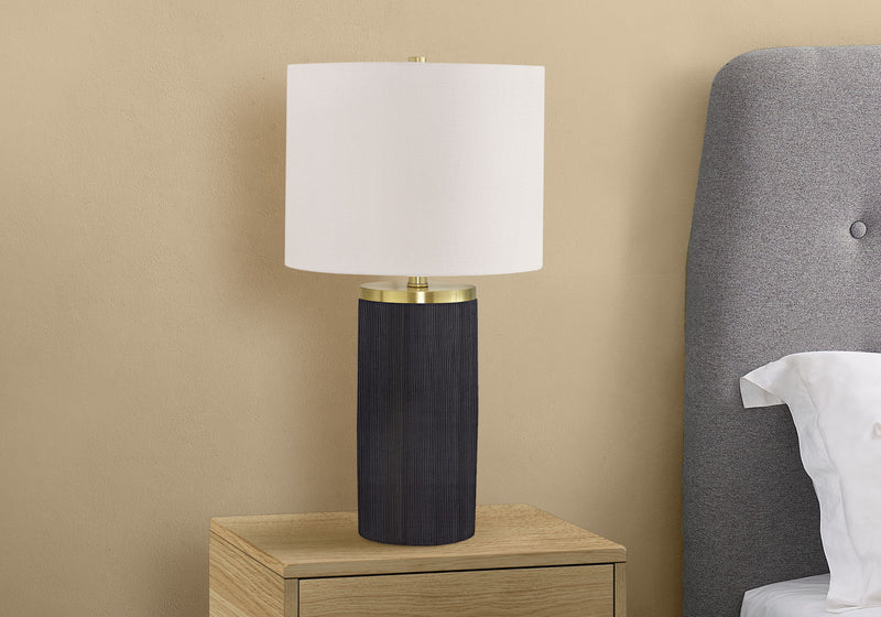 Modern table lamp with white shade and dark cylindrical concrete body