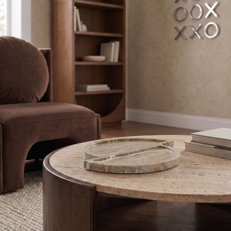 Gray-beige travertine tray on a tabletop, two circular halves stacked.