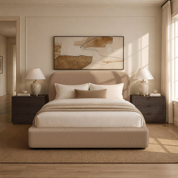 Light brown upholstered bed with rounded headboard and white bedding in room setting