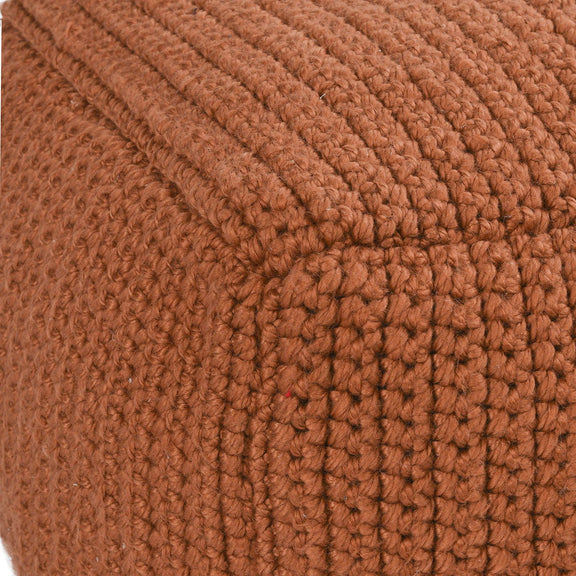 Terracotta knitted pouf fabric close-up with chunky ribbed crochet texture