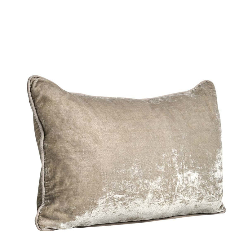 Natural-toned lumbar pillow with distressed whitewashed pattern and piped edges