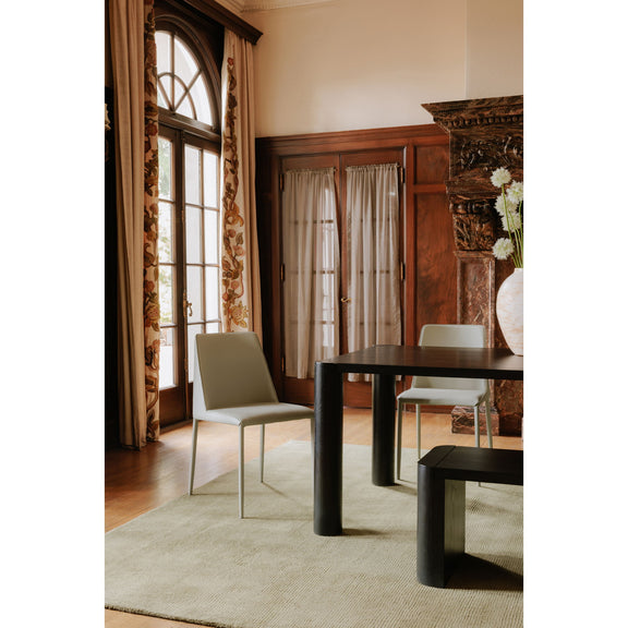 Black dining bench with thick rectangular frame and rounded corner legs