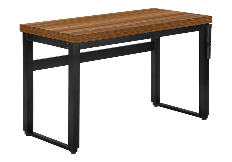 Standing adjustable computer desk with dark brown wood top and black metal legs