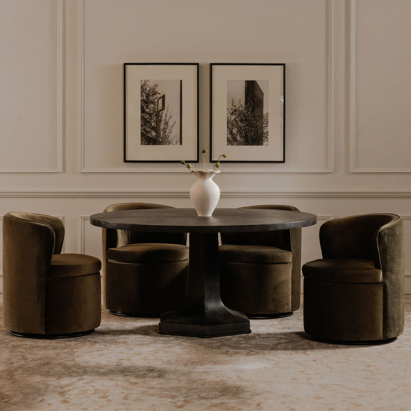 Green upholstered swivel chair, barrel shape, shown with matching seating around a table