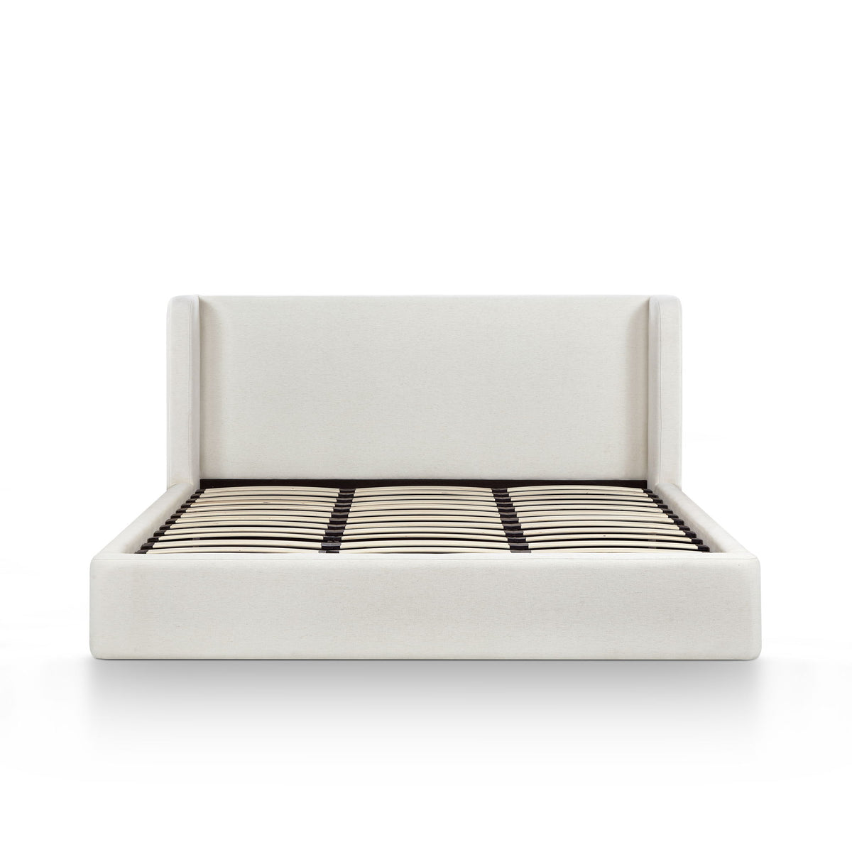 White upholstered bed frame with slatted mattress and black-and-white striped cover