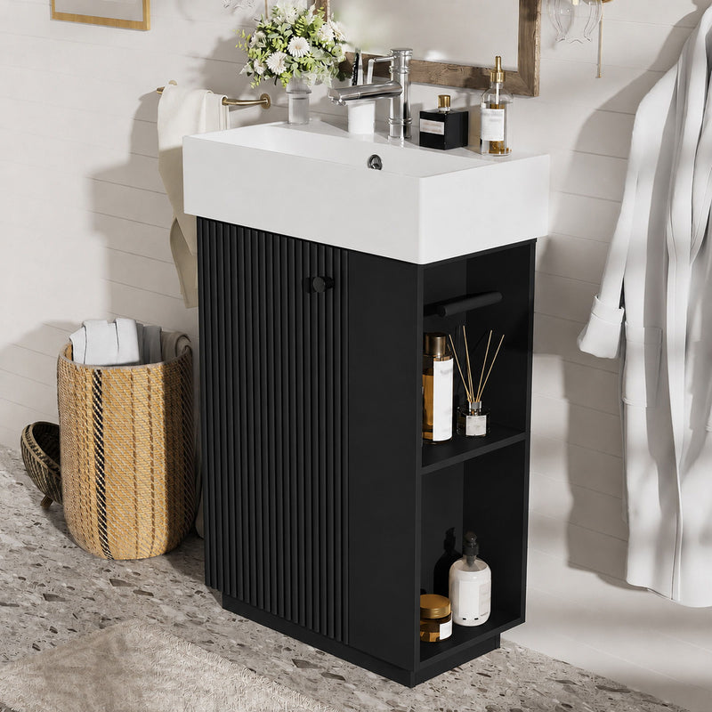 Freestanding bathroom vanity with white sink top and black storage cabinet with shelves