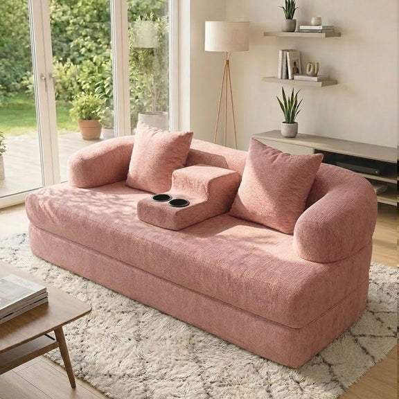 Pink convertible sleeper sofa bed with three back cushions and center cup holder