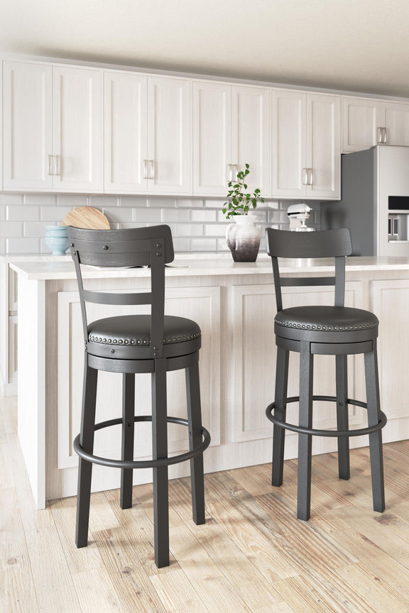 Tall upholstered swivel barstool with dark frame and gray round padded seat