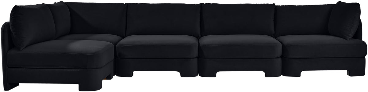 Black velvet sectional sofa with wide seats and multiple back cushions