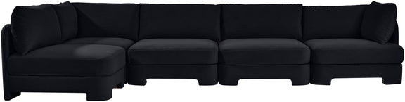 Black velvet sectional sofa with wide seats and multiple back cushions