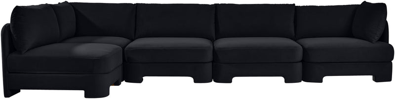 Black velvet sectional sofa with wide seats and multiple back cushions