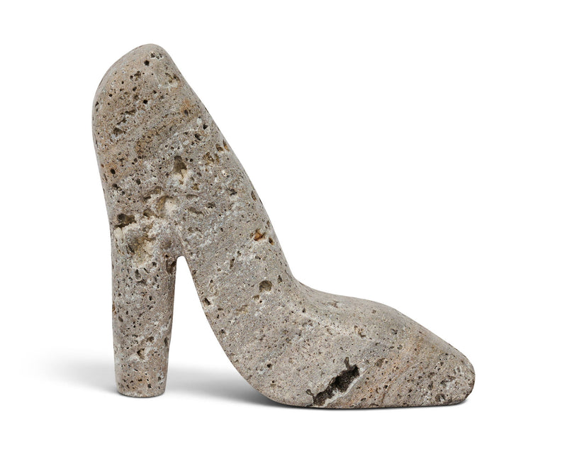 Gray travertine-style high-heel shoe tabletop sculpture with speckled texture
