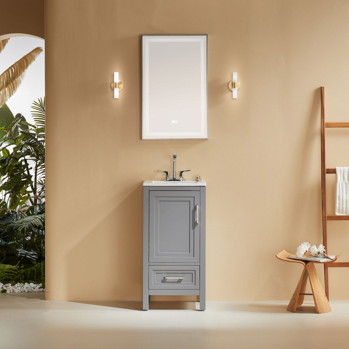 Gray freestanding bathroom vanity with white ceramic sink, cabinet door, and drawer