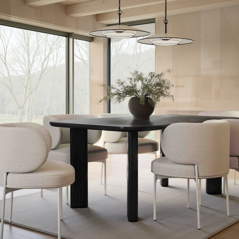 Set of off-white upholstered dining chairs with rounded backs and slim metal legs
