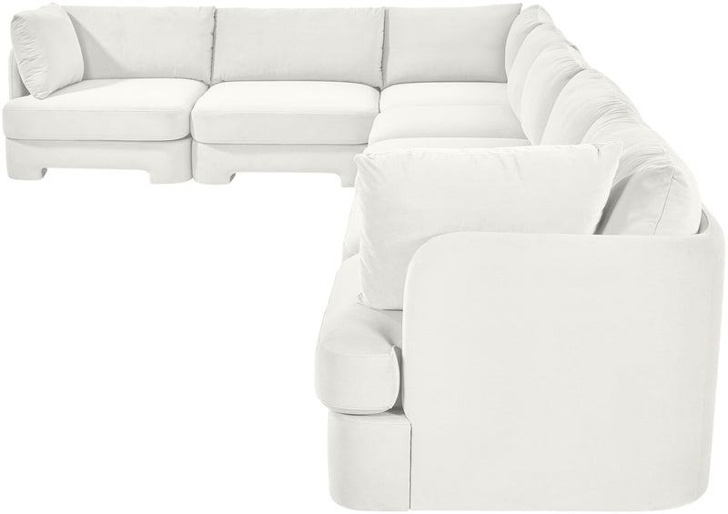 White velvet sectional sofa with rounded arm pads and plush seat cushions