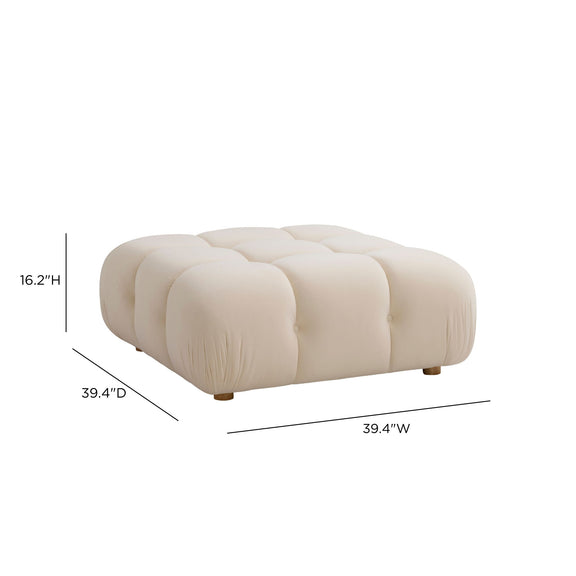 Cream modular ottoman with segmented top panels, button tufting, and wooden feet