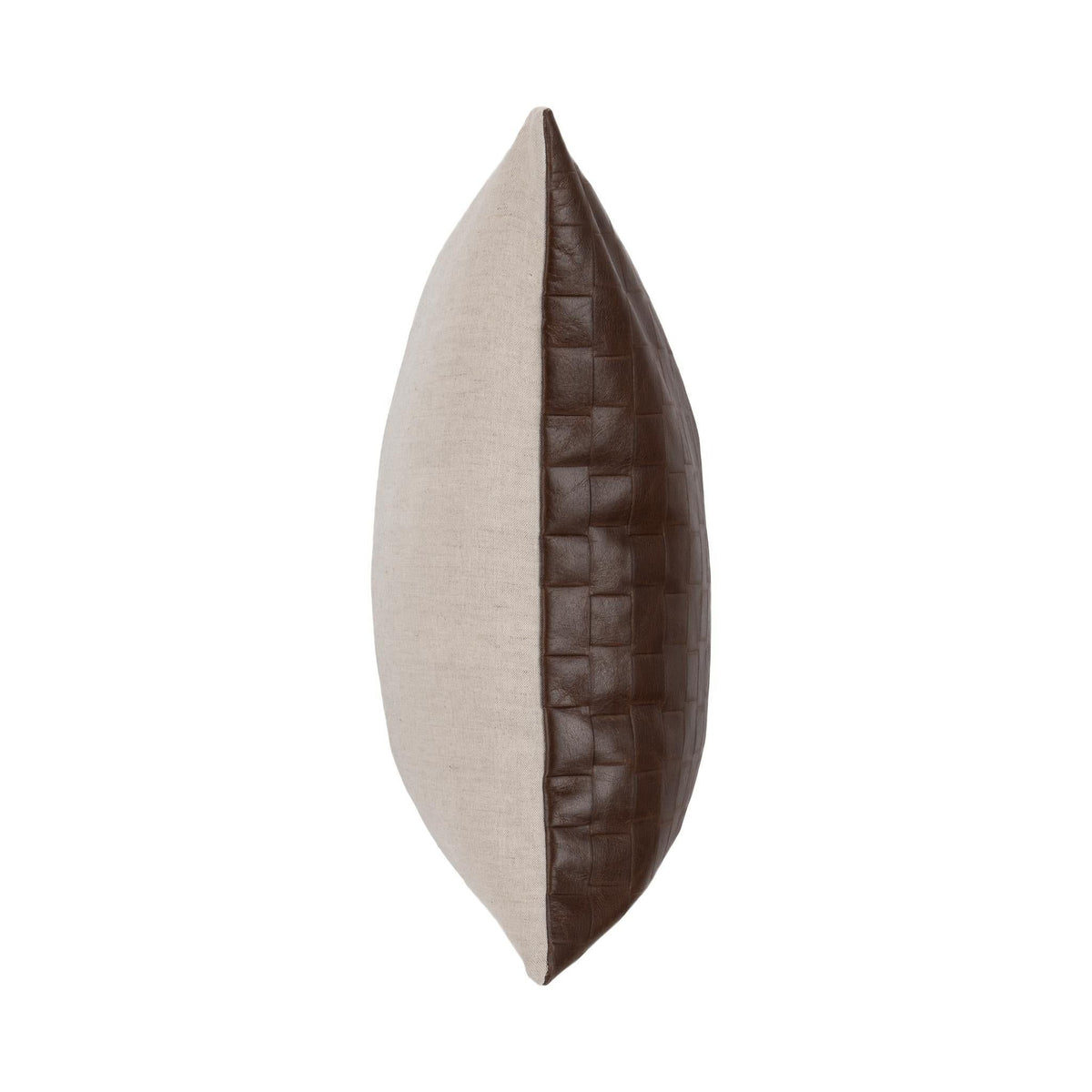 Brown leather pillow side view with quilted grid texture and stitched seam