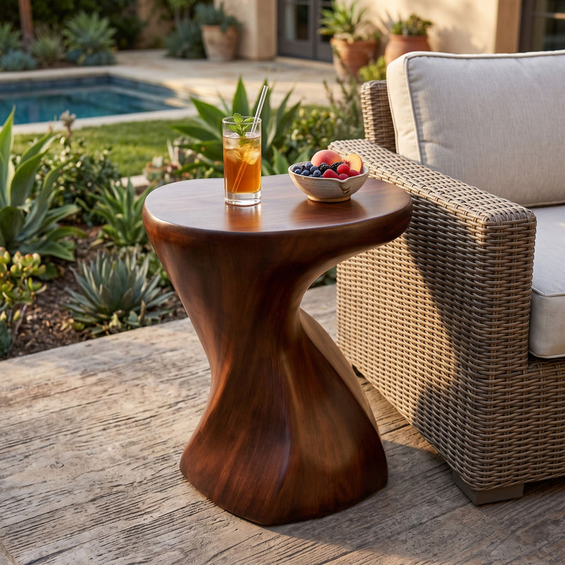 Twisted sculptural side table with round top and dark brown sculpted base