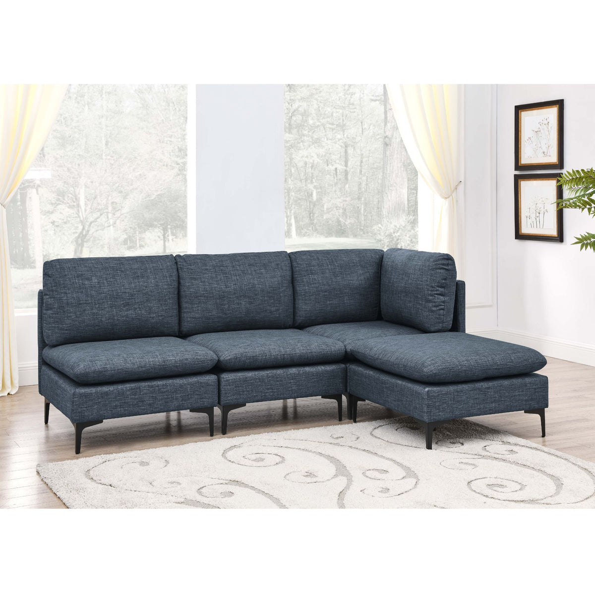 Dark gray modular sectional sofa with tall legs and deep chaise, upholstered cushions