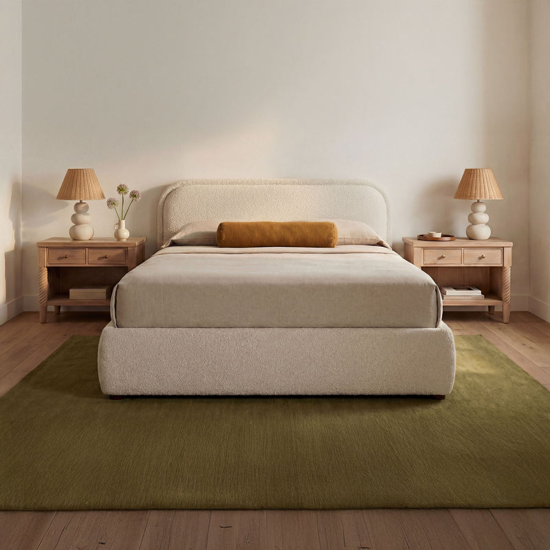 Upholstered king storage bed in oatmeal with padded headboard and platform base