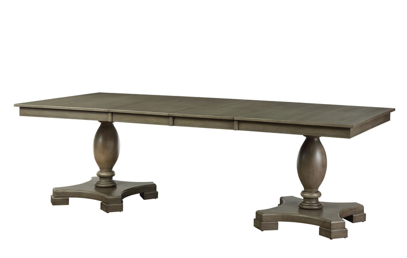 Rectangular dining table with dark gray top and turned pedestal legs