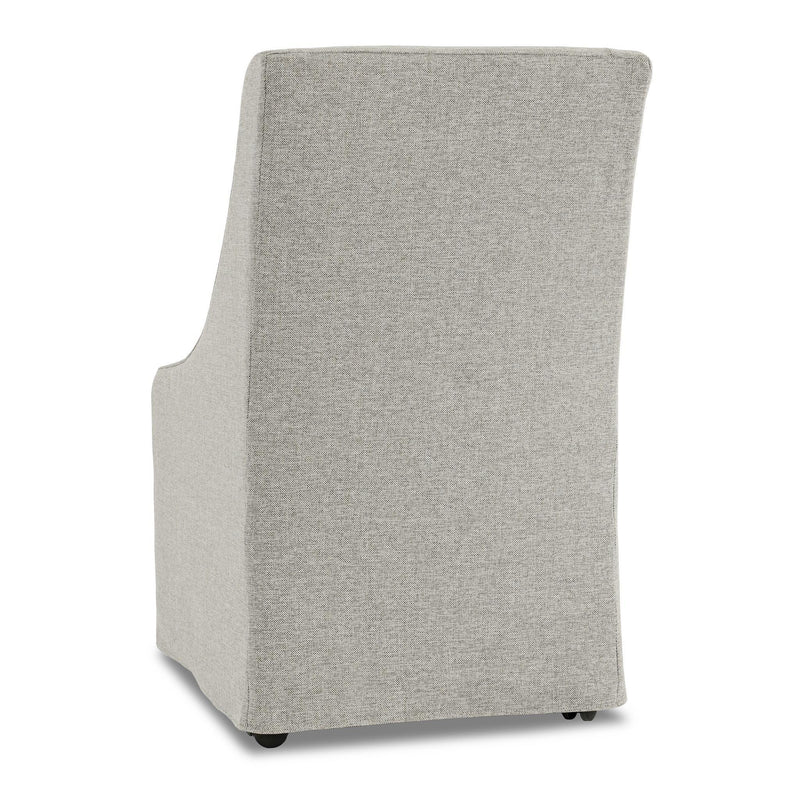 Gray upholstered rolling dining chair with tall, curved back and four casters.