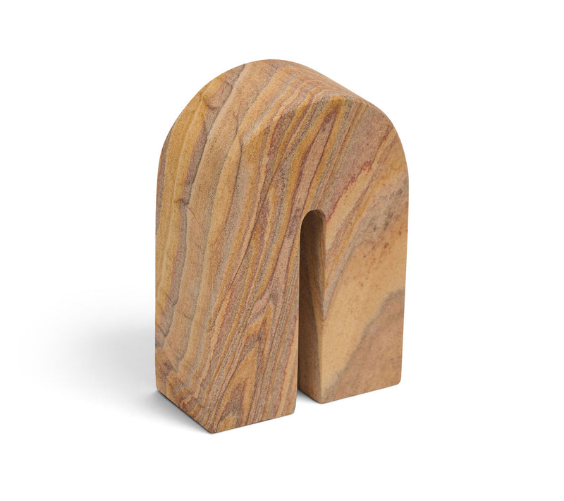 Sandstone bookend with U-shaped notch, striped tan and brown veining