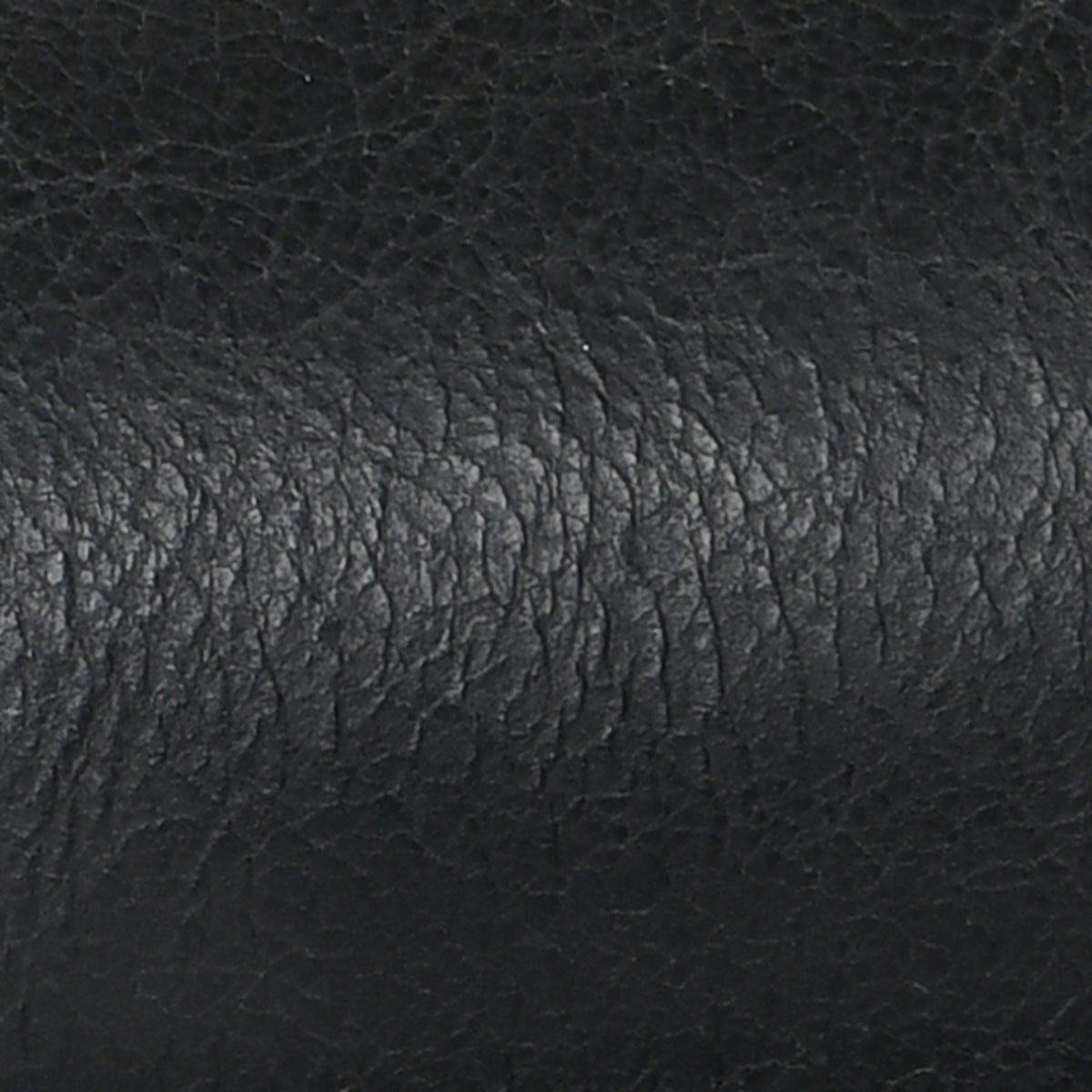 Dark leather upholstery texture with subtle mottled grain pattern close-up