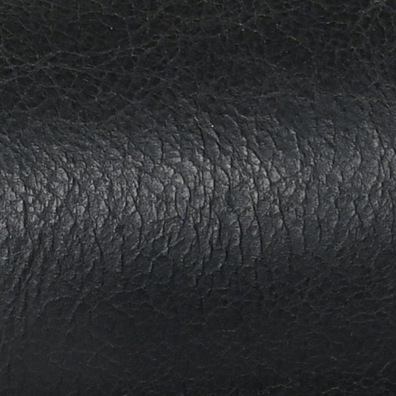 Dark leather upholstery texture with subtle mottled grain pattern close-up