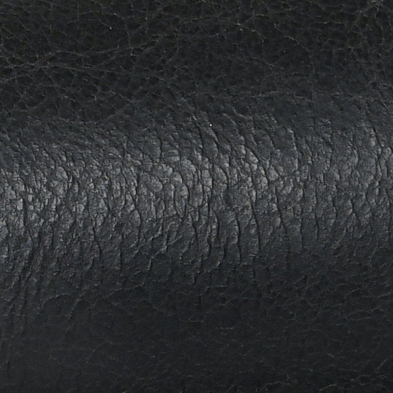 Dark leather upholstery texture with subtle mottled grain pattern close-up