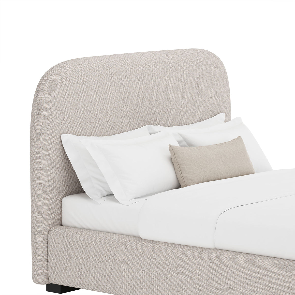 Light gray upholstered bed with rounded headboard and side panel, styled with pillows