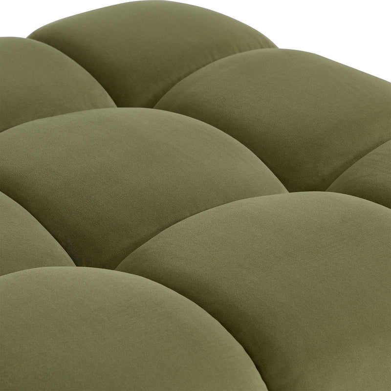 Olive green sectional upholstery close-up showing plush padded, scalloped cushion contours