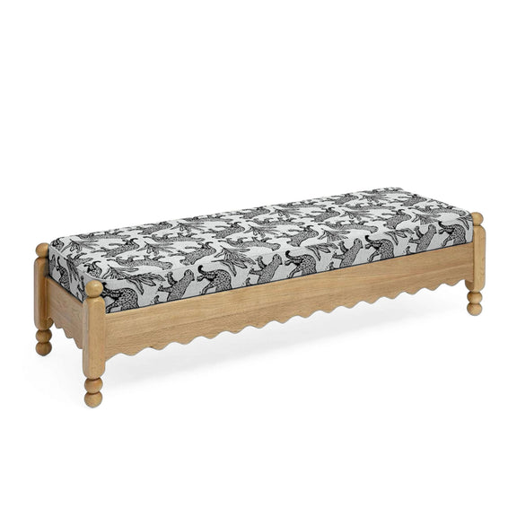 White leopard jacquard upholstered bench with scalloped apron and turned legs
