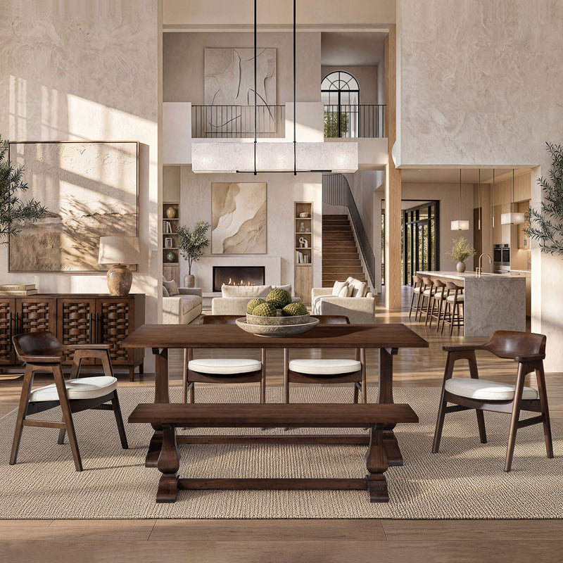 Light beige upholstered dining arm chair with curved back and dark wood frame