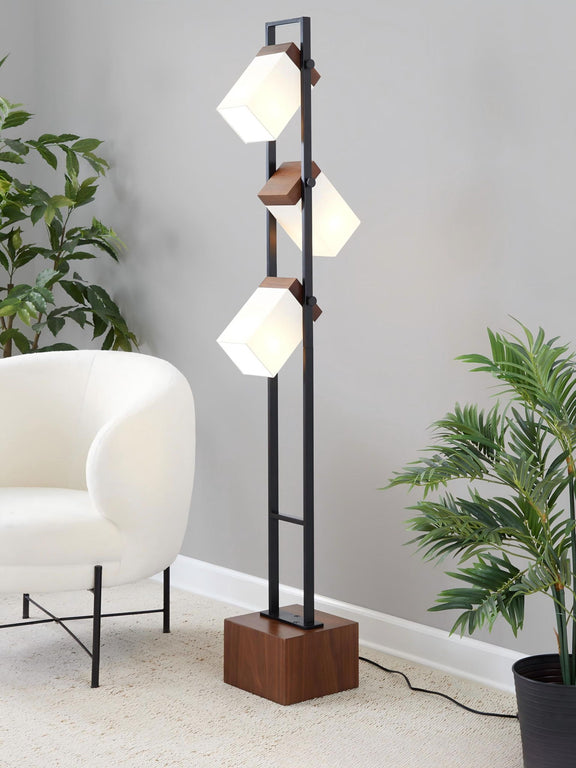 Black floor lamp with tiered white cube shades and walnut square base