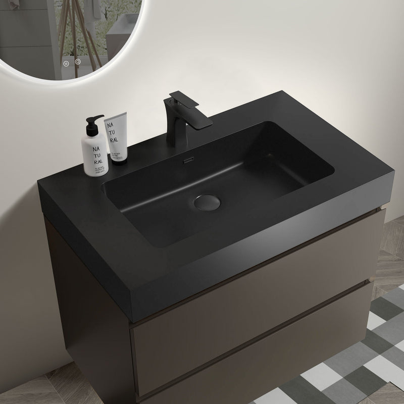 Black bathroom vanity with integrated sink and single-hole center drain, faucet included