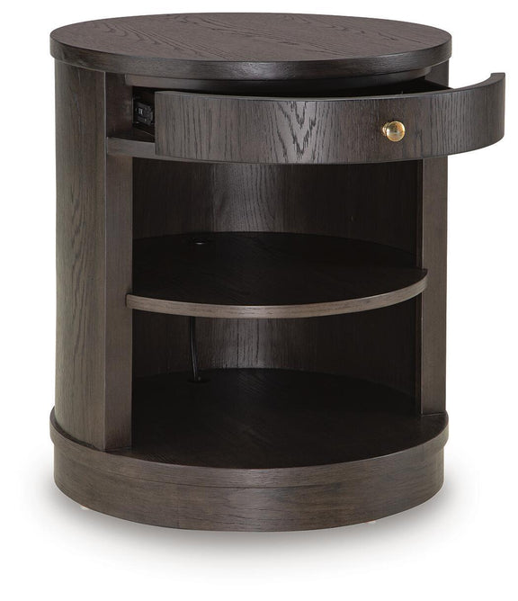 Dark brown round accent table with open drawer pulled out and curved open shelves