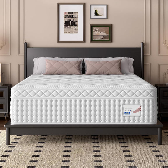 White king hybrid mattress on bed frame with quilted surface and two pillows