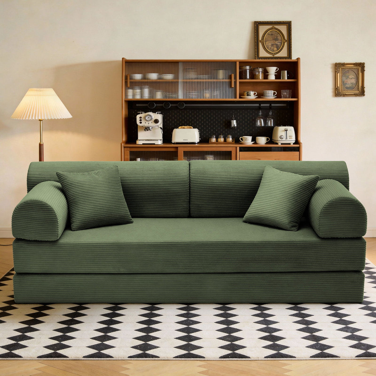 Green convertible sleeper sofa bed in living room with two front cushions.